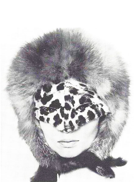 Adolfo created the cat-woman look in his 1964 collection. A leopard-skin mask and a red fox helmet made an arresting statement for winter sidewalks.